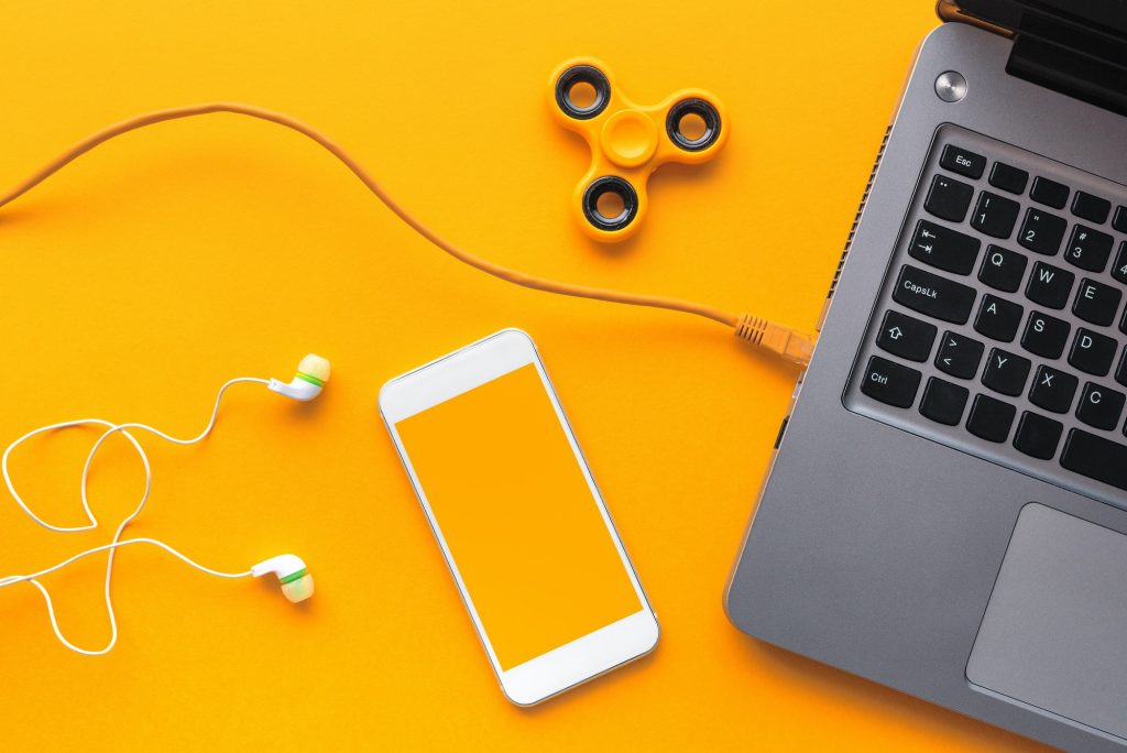 Gadgets belonging to young person, top view flat lay